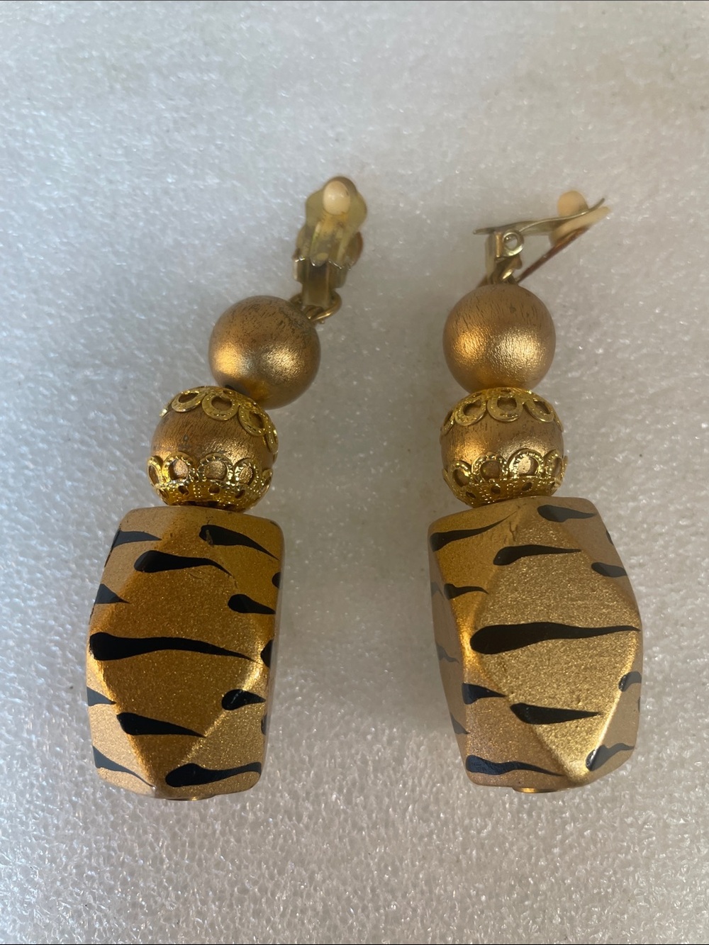Gold and Black Clip-On Drop Earrings with Animal-Print Accents